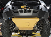 Underside view of the Roambuilt Mercedes Sprinter skid plate showing the removable oil change access panel, mounted together with the LoPro front bumper for full front-end protection.
