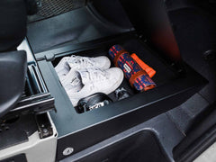 Items stored inside Sprinter Van Passenger Floor Riser Compartment for 2019+ Mercedes-Benz Sprinter vans