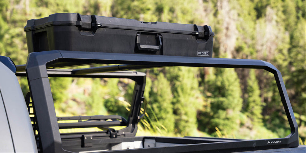 @expanded [A0036-MTRK] A black Honcho D-co Case mounted to a Kuat Roof Rack.