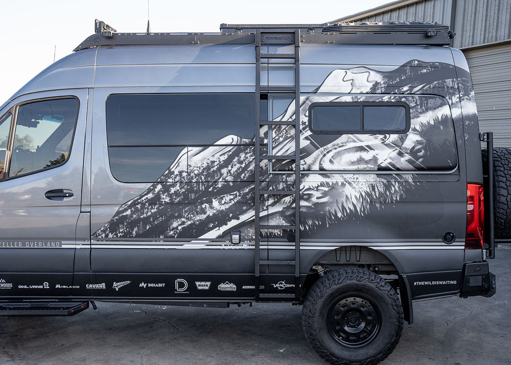 Full view of ROAMBUILT Flatpack Ladder mounted on a Mercedes Sprinter van, showing all-aluminum construction and wide, notched traction steps.