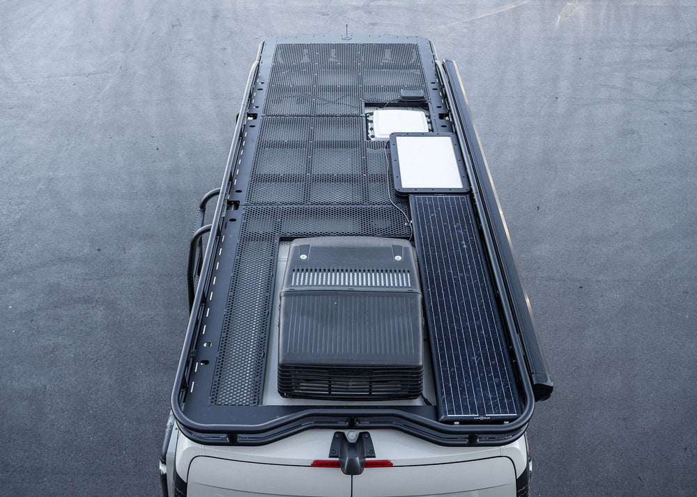 Overhead view from the rear showing the entire ROAMBUILT Safari 2.0 roof rack with curved front, perforated decking, and modular 3- or 4-piece design for 2007+ Sprinter vans.