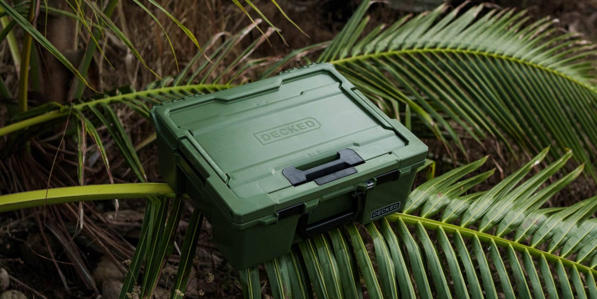 [A0020-HRAK-GRN] @expanded The Ranger Green Halfrack sitting on top of a palm frond, the image screams Ranger Green.