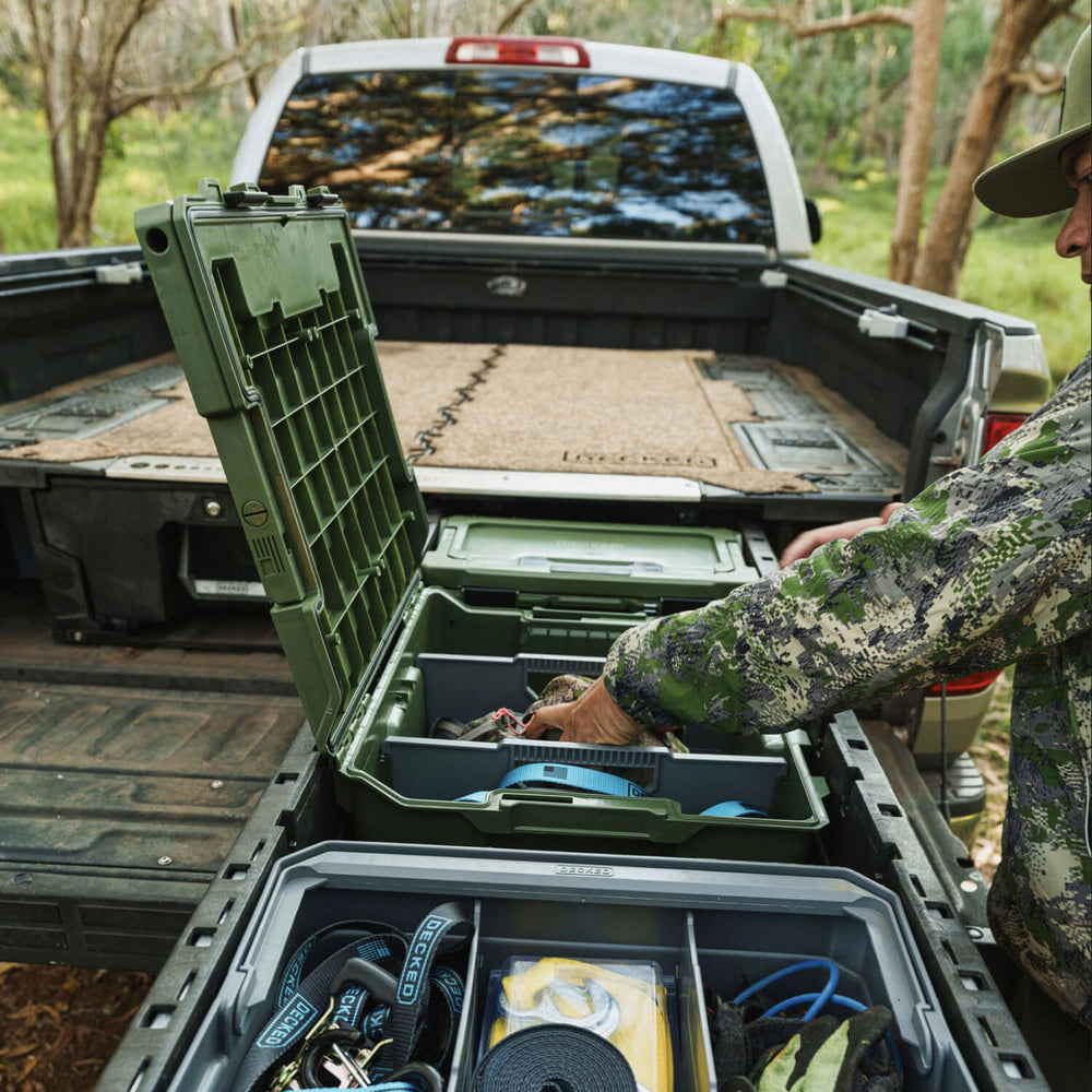[A0020-HRAK-GRN] A hunter retrieving his bino harness from his Ranger Green Halfrack 32 stored neatly in his Drawer System.