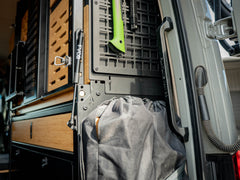 Sprinter Van Rear Door Grab Handle with black logo installed in Sprinter van