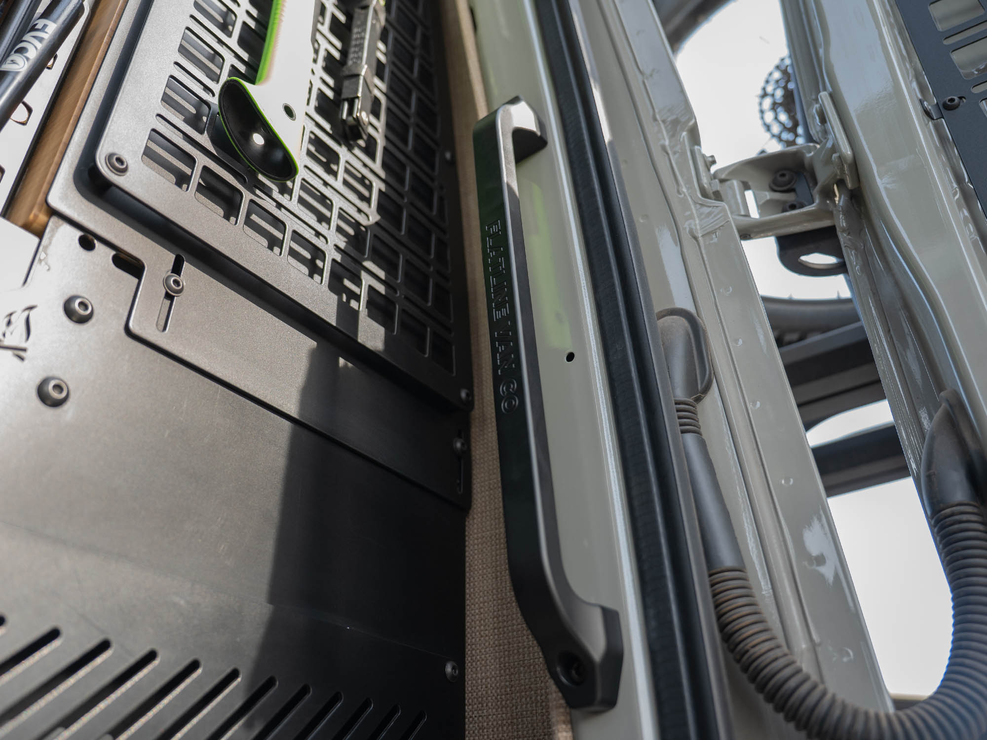 Black etched logo option of the Sprinter Van Rear Door Grab Handle installed