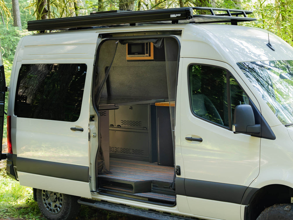 View of Modular Cabinet Bed System for Sprinter & Transit from the slider door installed in Sprinter 144 