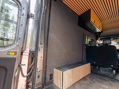 View showing both driver-side pieces of the Transit Bed Bracket Flush Mount L-Track installed in 148" High Roof