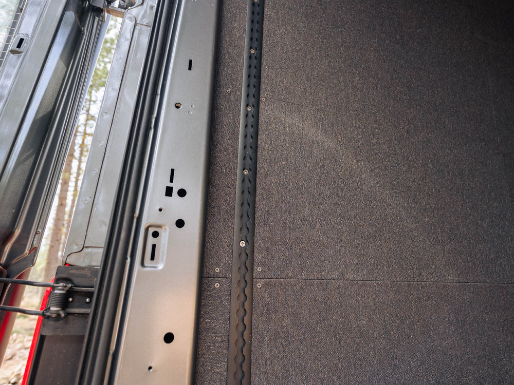 Transit Bed Bracket Flush Mount L-Track installed in van with insulated walls