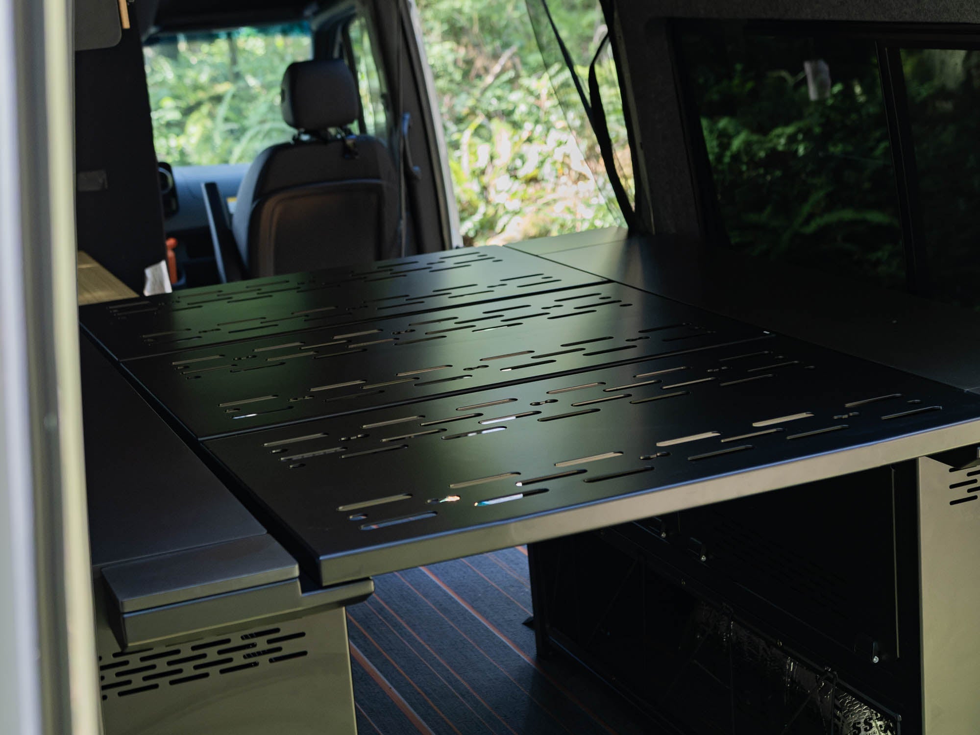Modular Cabinet Bed System for Sprinter & Transit installed, set up with bed panels in place for sleeping