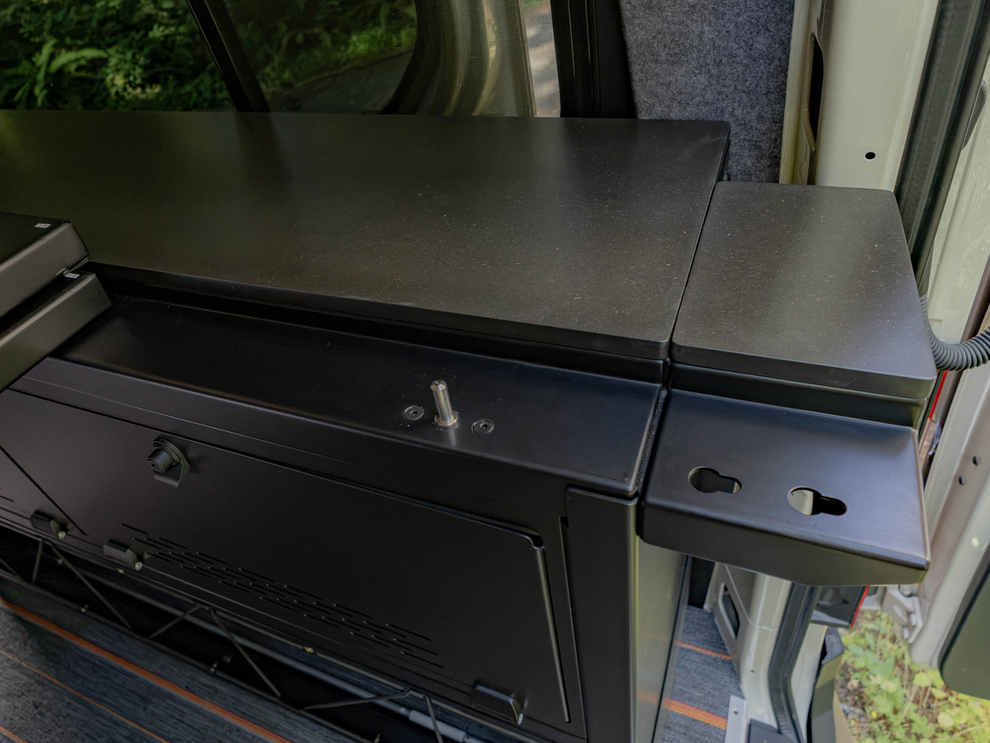 Installed Modular Cabinet Bed System for Sprinter & Transit showing bed panel pin and durable counter top
