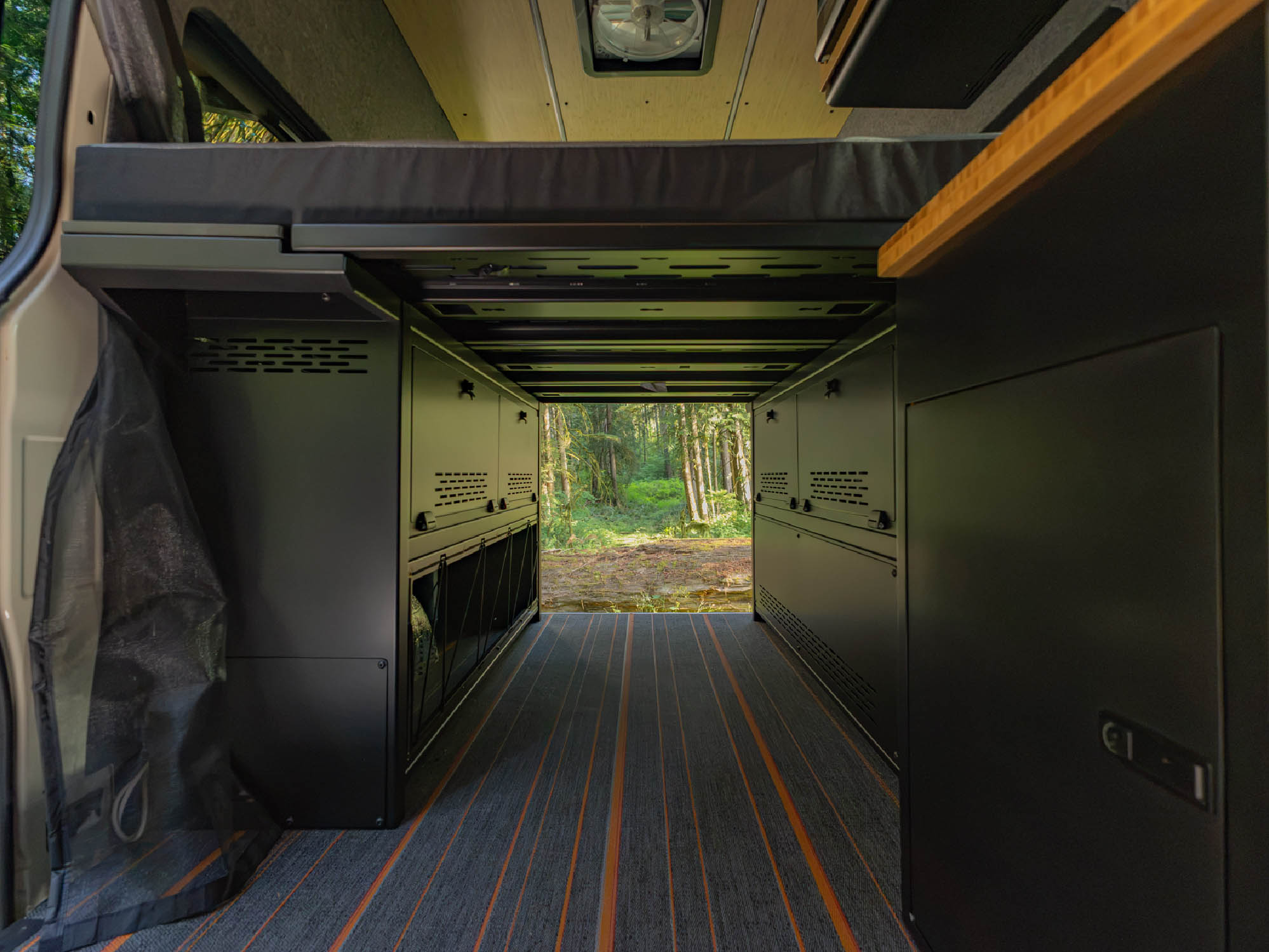 Storage space underneath the installed bed panels of the Modular Cabinet Bed System for Sprinter & Transit 