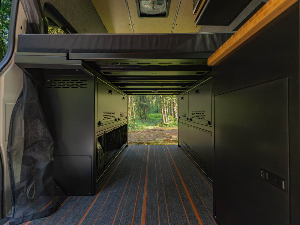 Storage space underneath the installed bed panels of the Modular Cabinet Bed System for Sprinter & Transit 