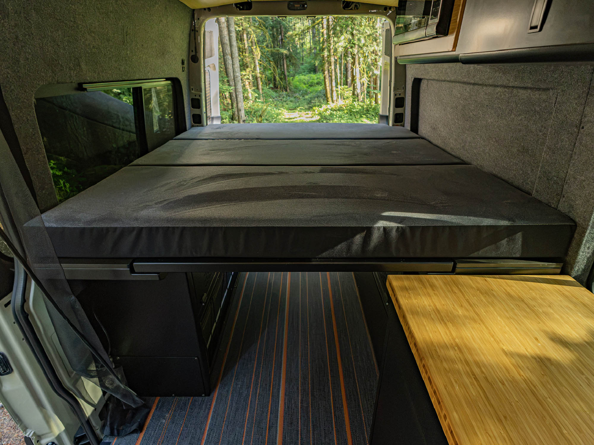 Modular Cabinet Bed System for Sprinter & Transit installed with custom fit mattress