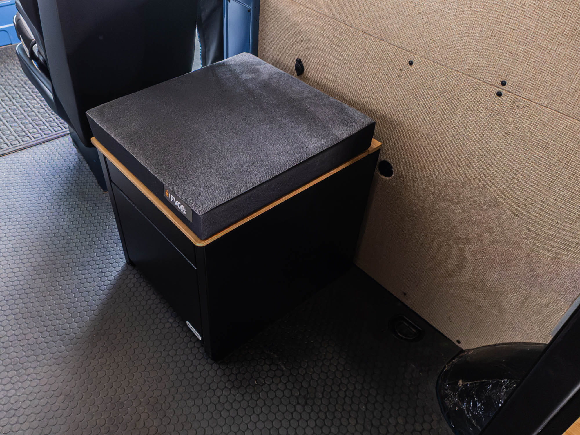Portable Toilet Storage Cubby installed in adventure van ready for family weekends
