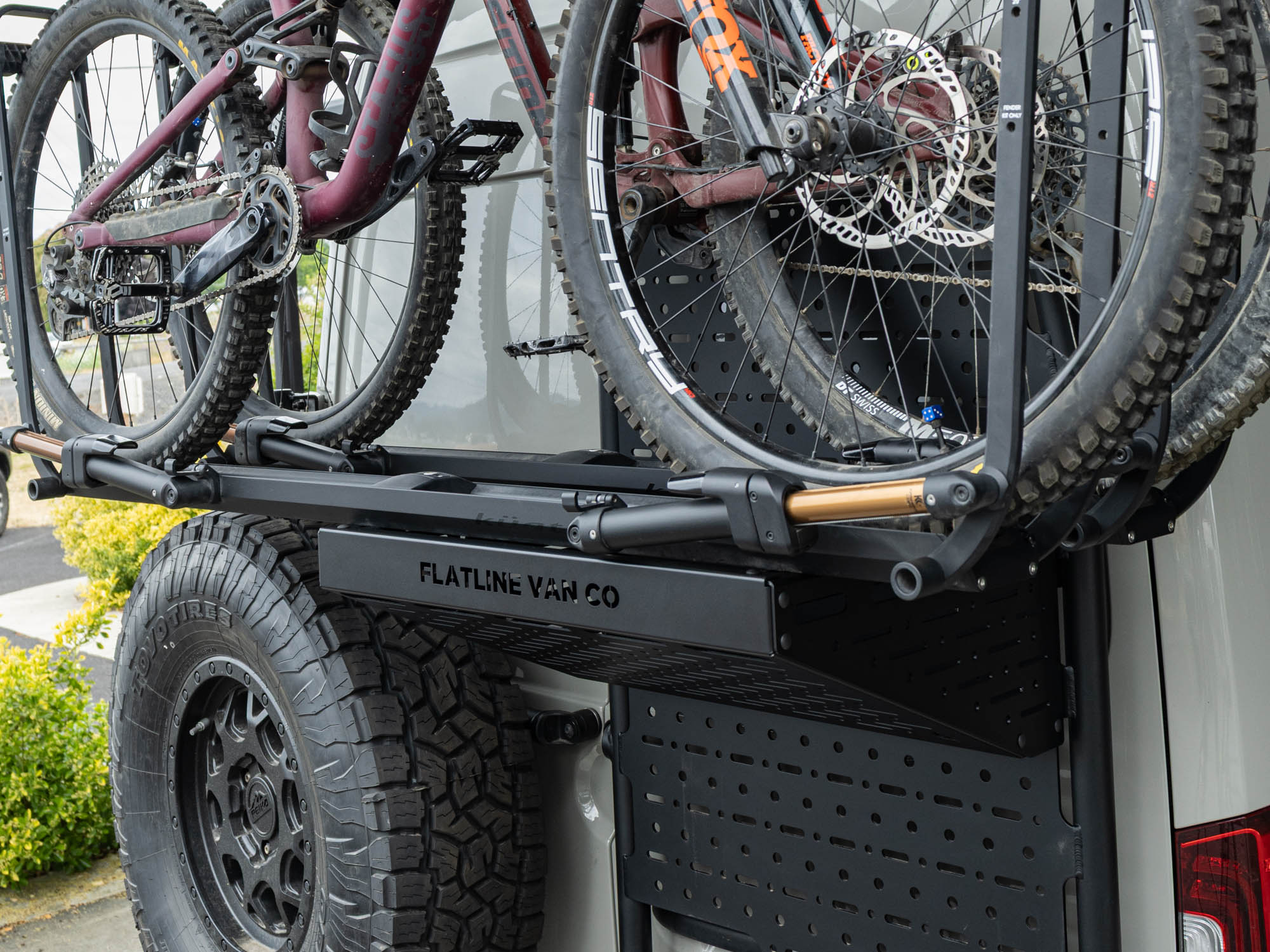Mountain bikes stored on Sprinter Rear Door using Kuat Bike Trays on the Rear Door Platform Bike Rack Adapter