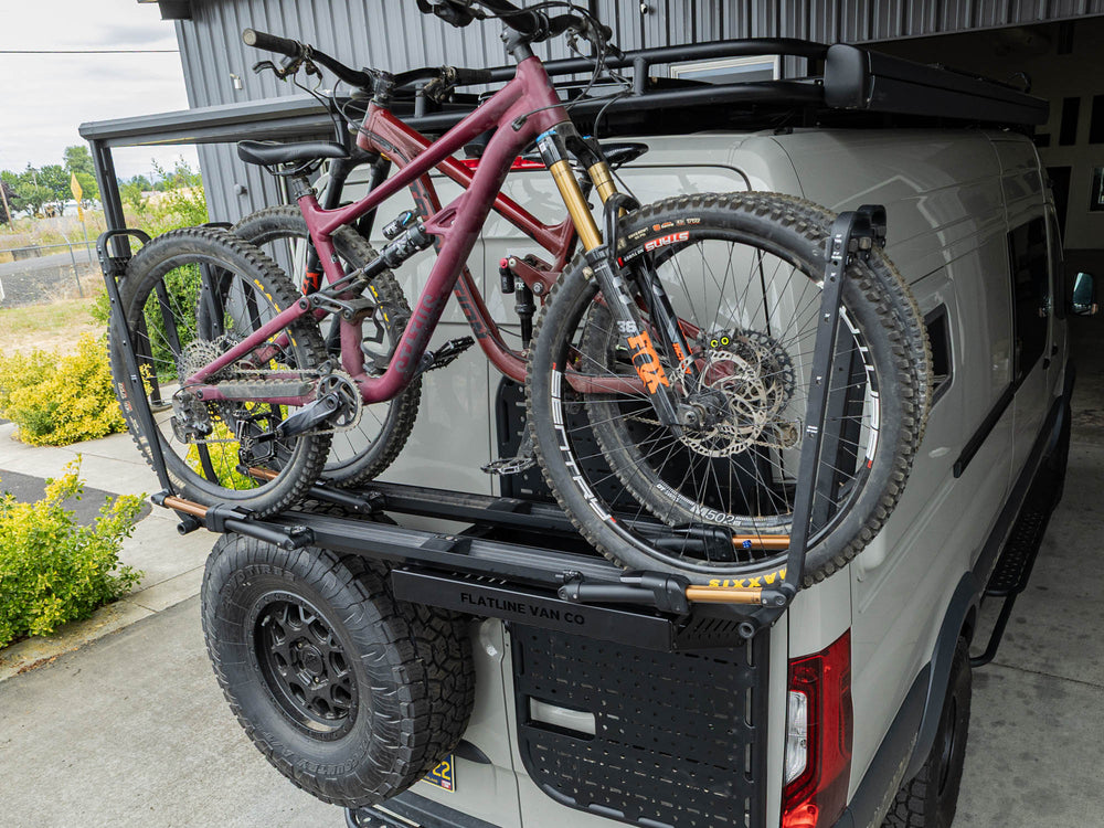 Sprinter van carrying two mountain bikes on the Rear Door Platform Bike Rack Adapter with Kuat Piston SR Bike Racks