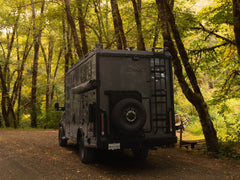 Winnebago Ekko Rear Bumper for Sprinter and Transit vans installed on rig driving in the woods