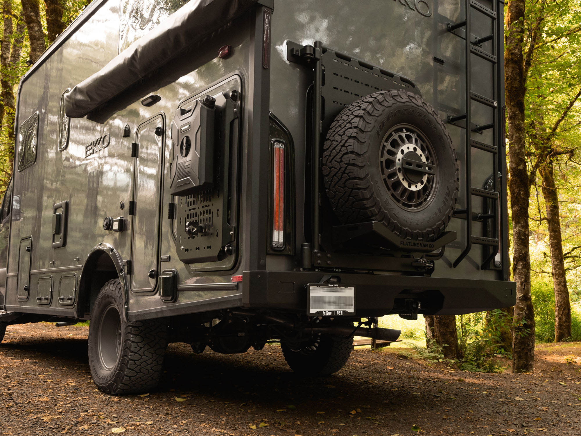 Winnebago Ekko Rear Bumper for Sprinter and Transit vans installed, along with Rear Platform with Tire Carrier Mount setup, and Rear Ladder installed