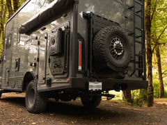 Winnebago Ekko Rear Bumper for Sprinter and Transit vans installed, along with Rear Platform with Tire Carrier Mount setup, and Rear Ladder installed