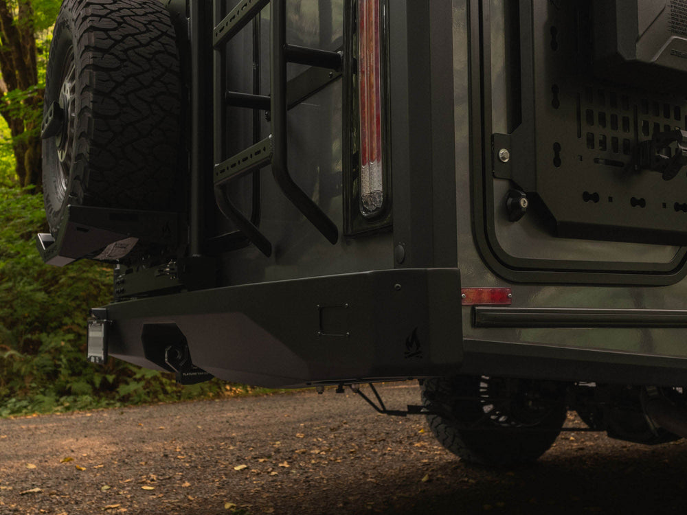 Detail image of Winnebago Ekko Rear Bumper for Sprinter and Transit vans, showing rear lighting cut-out option with cover plate in use instead of lights