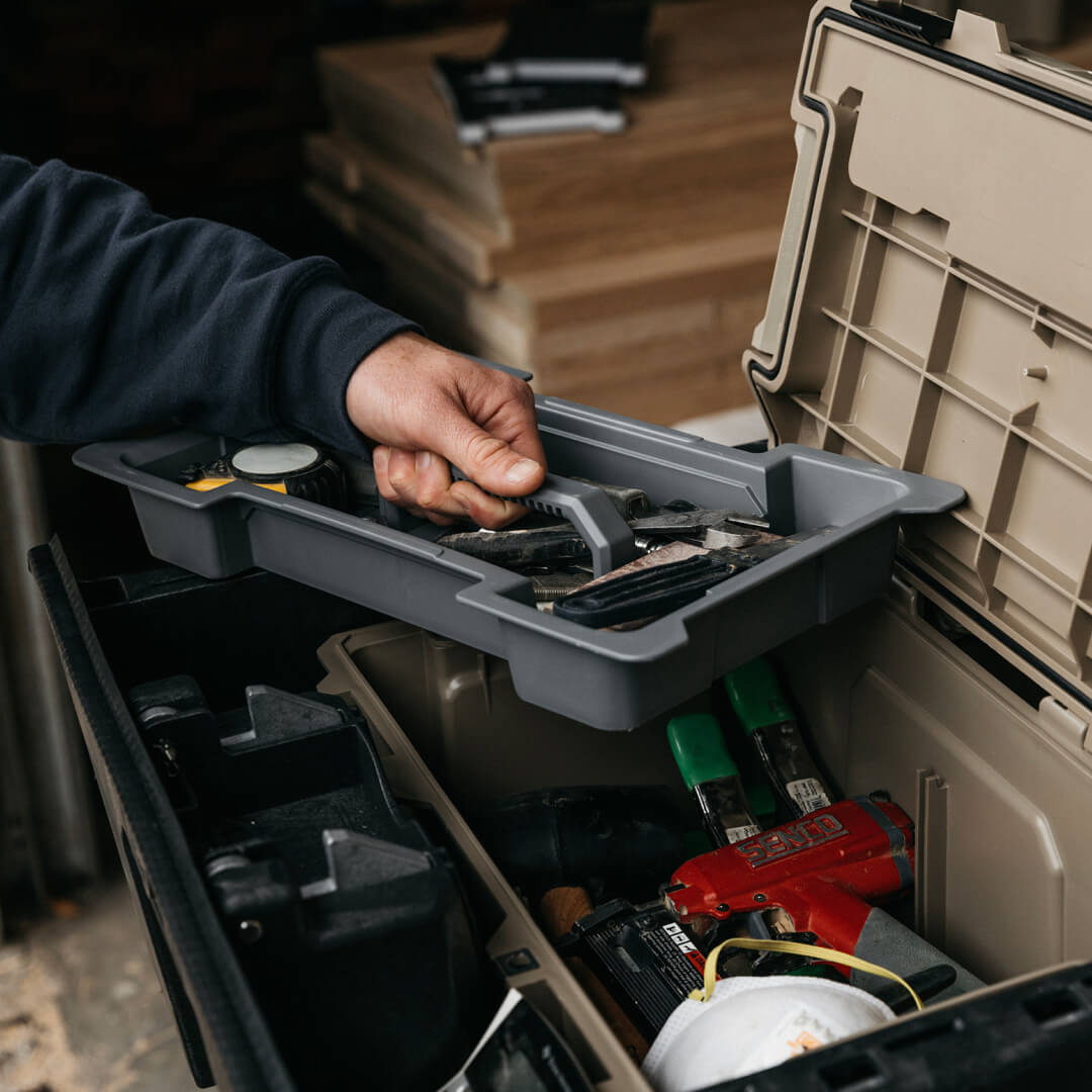 [A0090-DTRY-GRY] Man pulling a D-co Case cargo tray full of tools out of his Sixer