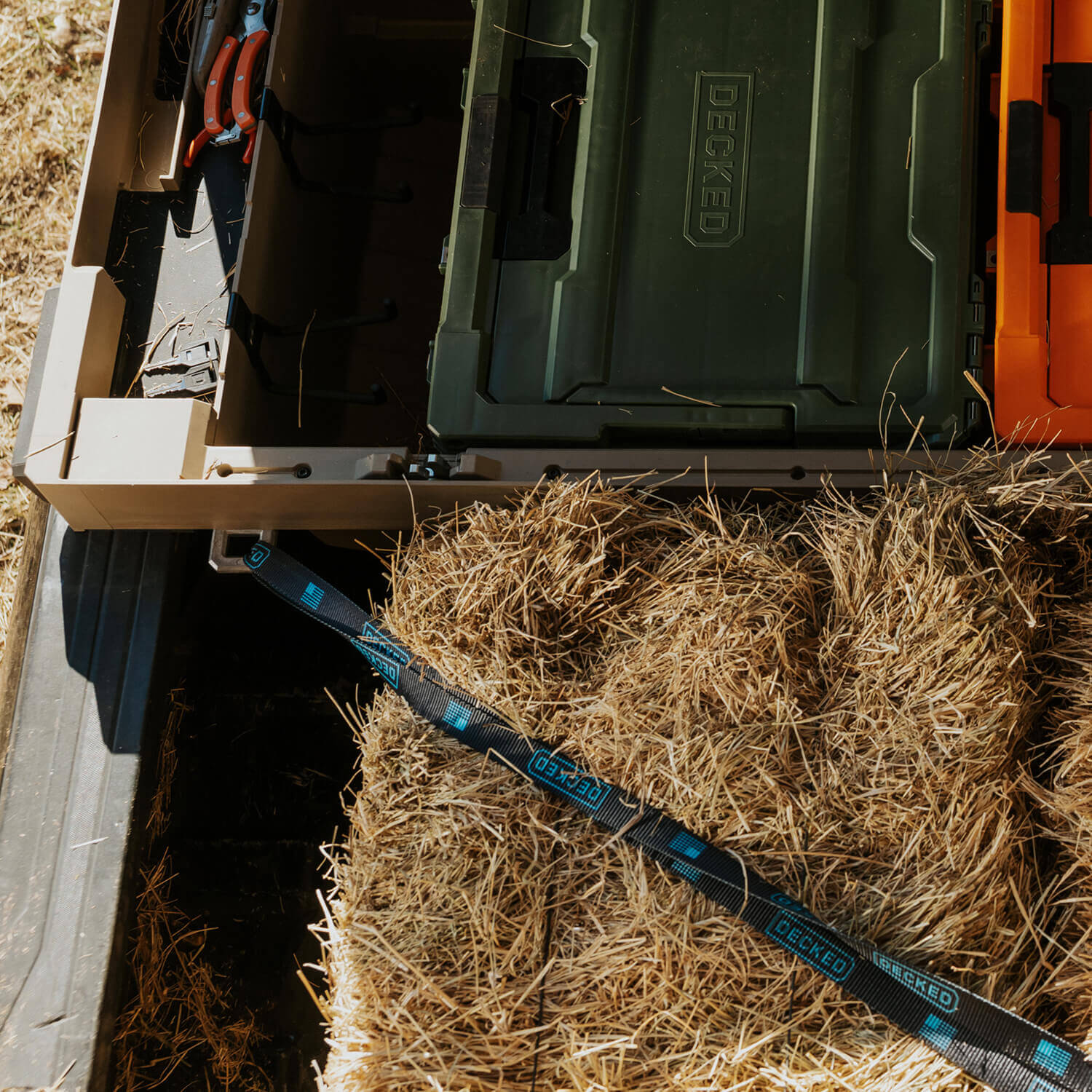 [ATB-DRING] D-ring tie-downs securing hay and other items in the bed of a truck.
