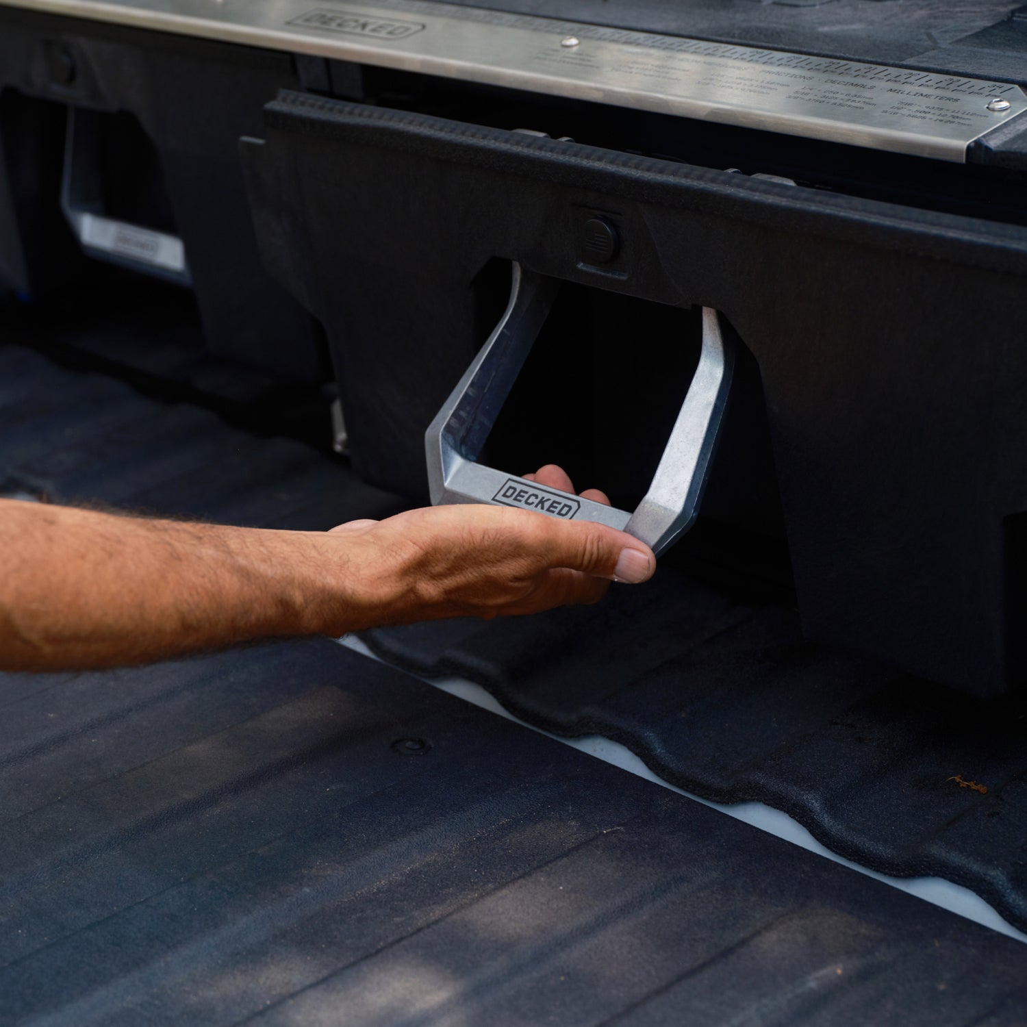 [XS4G, XF7G, XG9G] A person pulling the Drawer System handle to open the drawer.