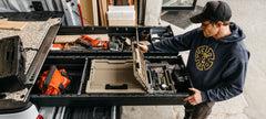 [XF6, XF7, XG5, XG9, XG10, XR5, XS4, XS5] @expanded Overhead view of a man opening a Sixer inside a Full-Size Drawer System.