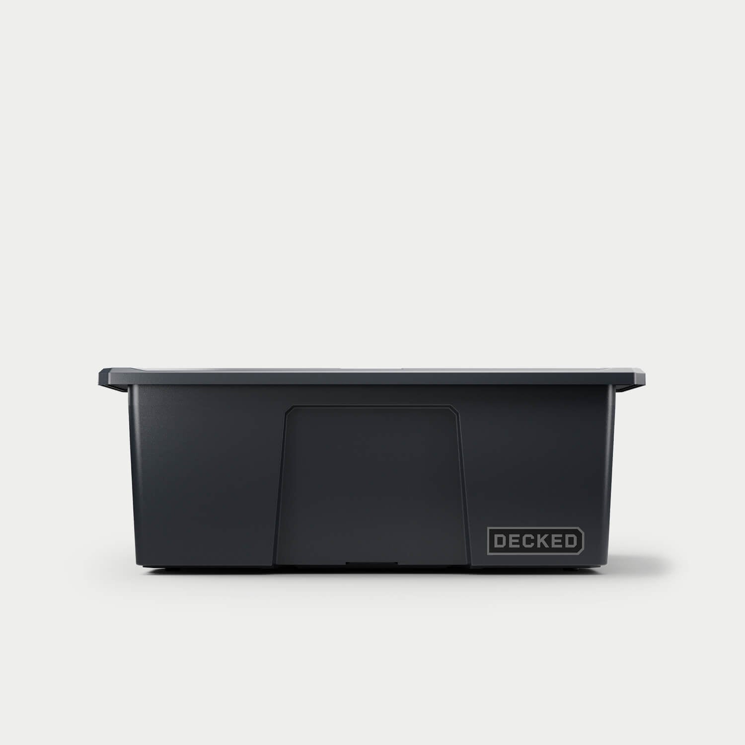 [A0041-DBIN-BLK] The front of one black Payloader bin, closed on a white background with a DECKED logo in the bottom right hand corner of the bin.