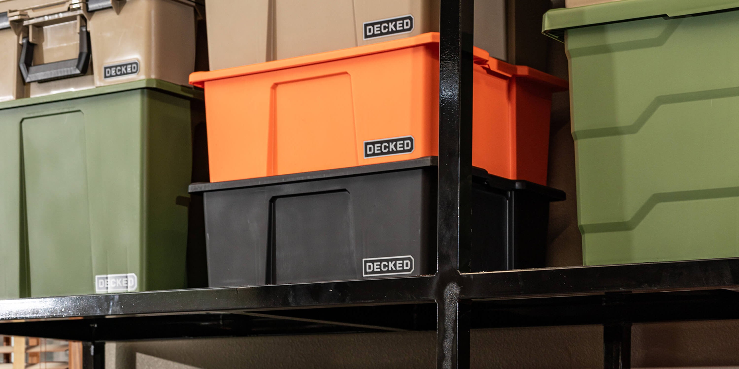 [A0041-DBIN-BLK] @expanded Stack of Payloader bins in various colors with 'DECKED' branding on a metal shelf.