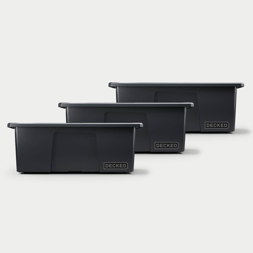 [A0040-DBIN-BLK] Three black Payloader bins, closed on a white background, staggered diagonally.