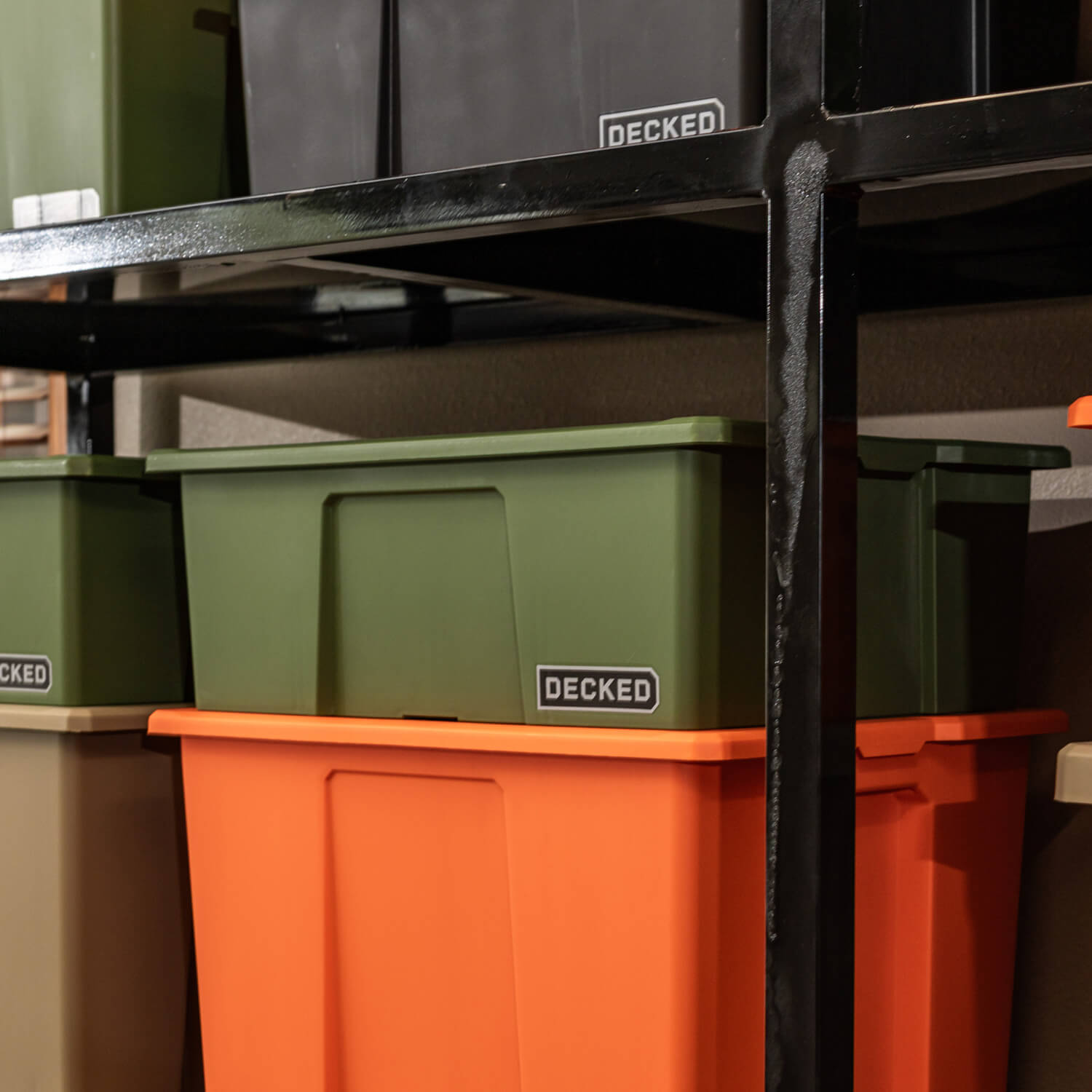 [A0041-DBIN-GRN, A0040-DBIN-GRN] A ranger green Payloader Bin stacked on top of another bin on shelving in a garage.