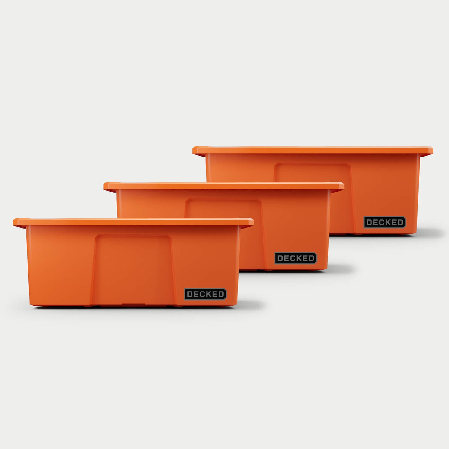[A0040-DBIN-ORG] Three blaze orange Payloader bins, closed on a white background, staggered diagonally.