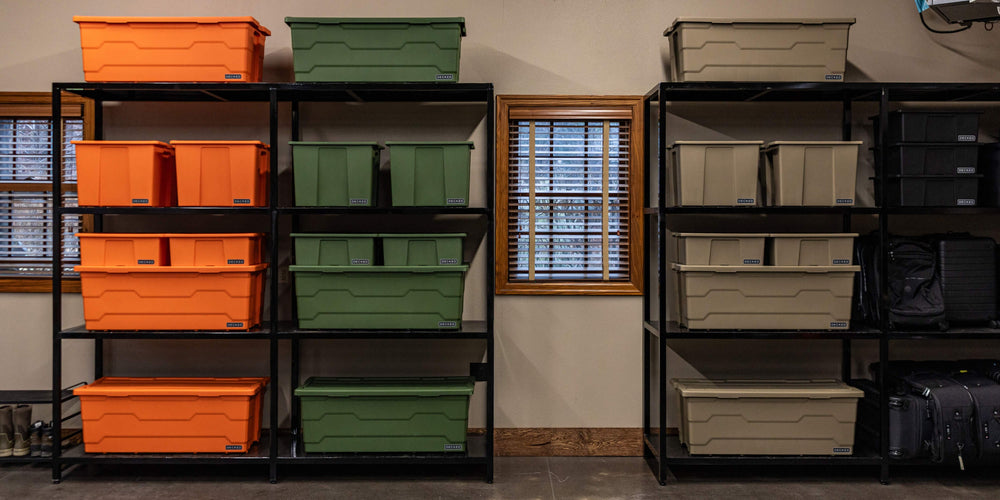 [A0040-DBIN-XXX, A0040-DBIN-GRN] @expanded Storage shelves in a garage filled with various sizes of DECKED Payloader Bins, organized by color.