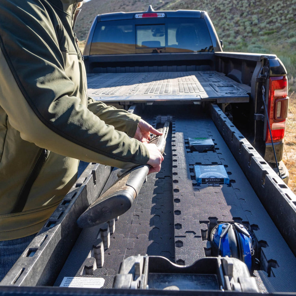 [A0150-PZFM-VXLG, A0151-PZFM-VXST] A man removing his shotgun from his Drawer System Piecekeeper PuzzleFoam.
