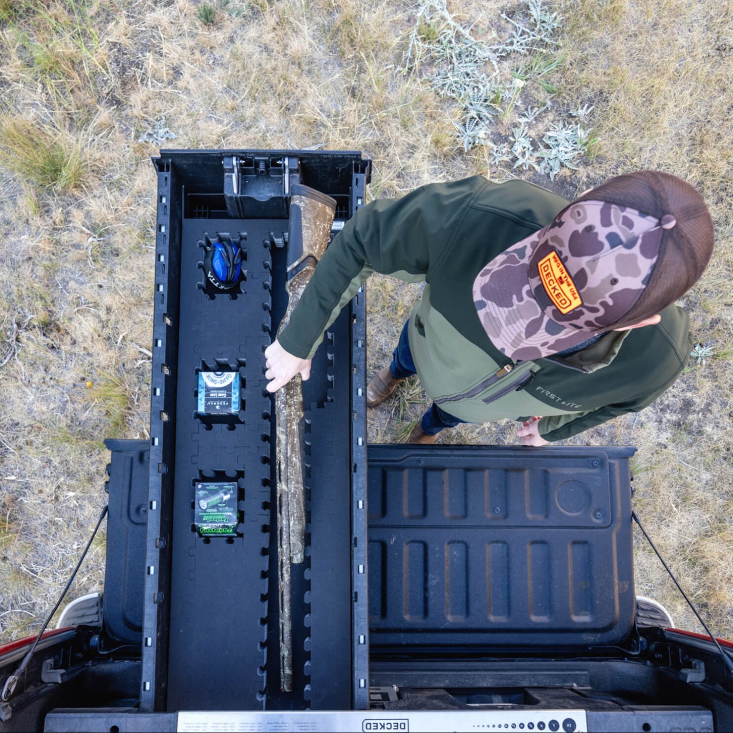 [A0150-PZFM-VXLG] A man retrieving his bird hunting gear, including his shotgun and shells, out of his Drawer System's Piecekeeper PuzzleFoam organizer.