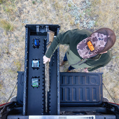 [A0150-PZFM-VXLG] A man retrieving his bird hunting gear, including his shotgun and shells, out of his Drawer System's Piecekeeper PuzzleFoam organizer.