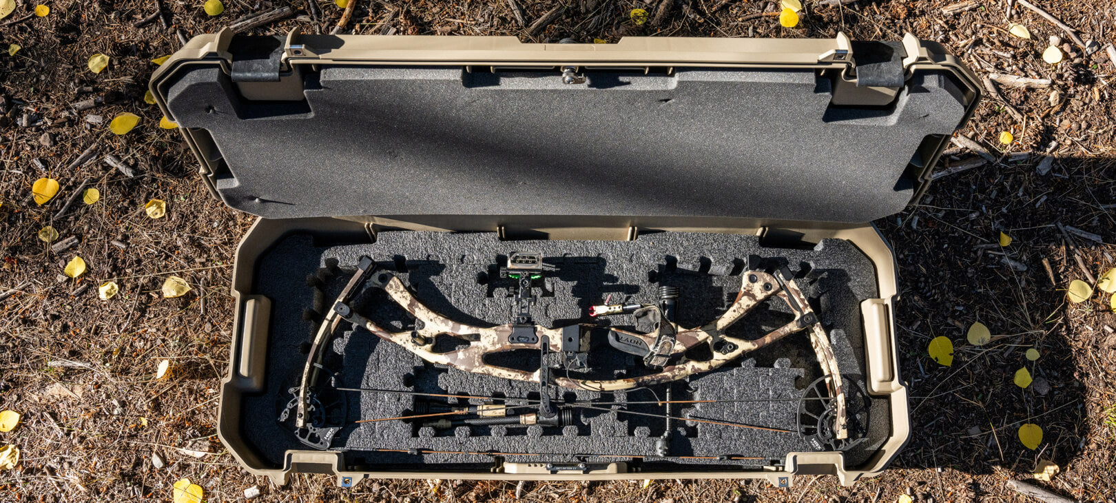 [A0031-MANF-TAN] @expanded A Desert Tan Honcho 80 open with a bow perfectly fit into the PuzzleFoam insert.