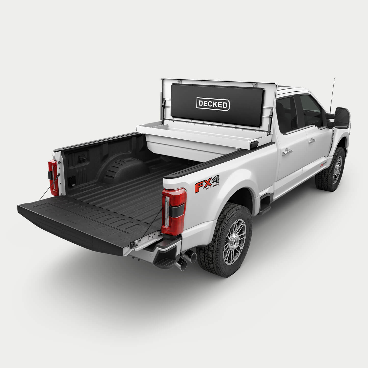 [google-white-tool-box] White pickup truck with an white DECKED Tool Box open in the bed.